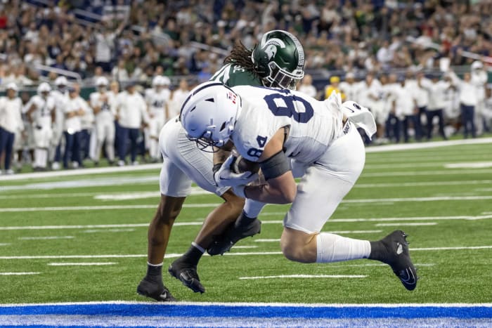 Nov 24, 2023; Detroit, Michigan, USA; Penn State Nittany Lions tight end Theo Johnson (84) scores a touchdown against the Michigan State Spartans during the second half at Ford Field. Mandatory Credit: David Reginek-USA TODAY Sports